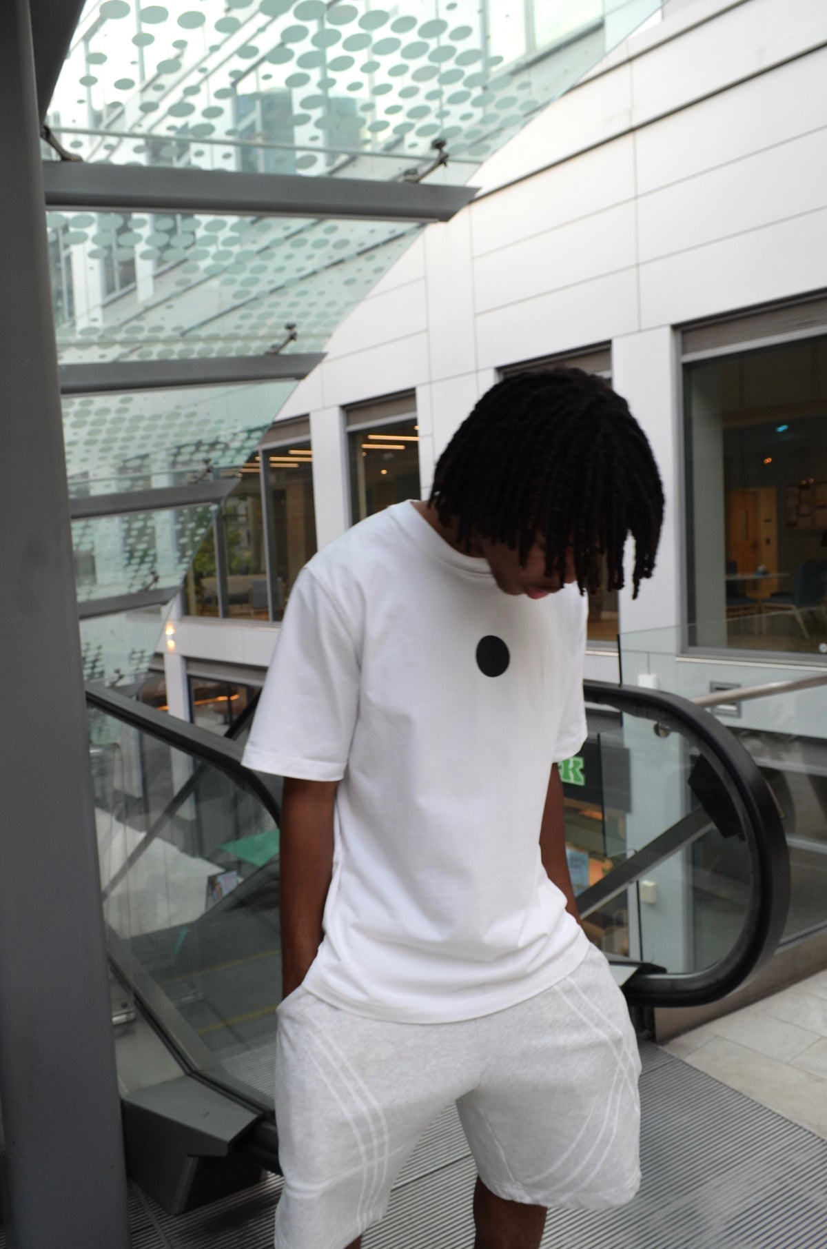 Model wearing Ulquiorra shirt, side angle with hollow hole graphic visible
