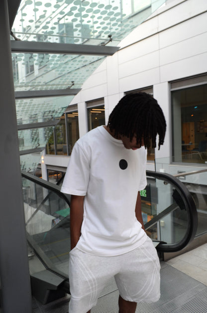 Model wearing Ulquiorra shirt, side angle with hollow hole graphic visible