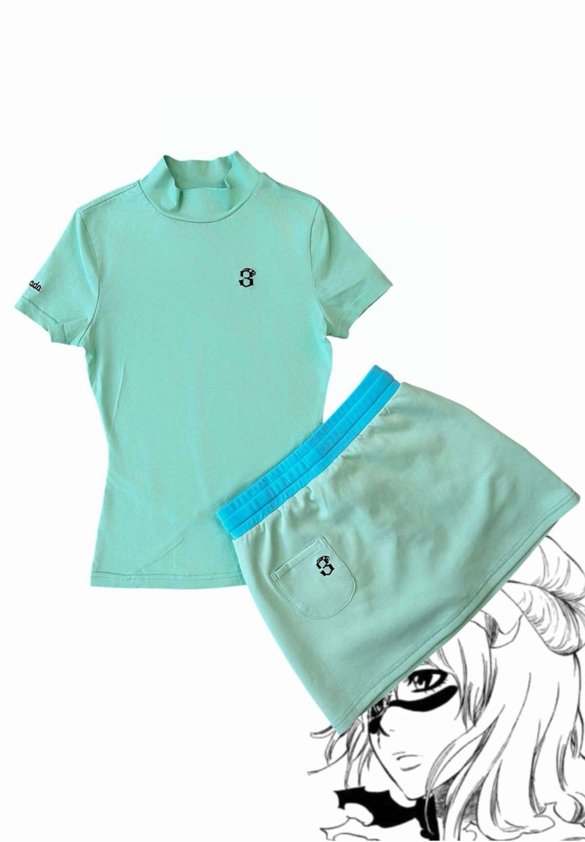 Nel set styled flat lay, mint shirt and skirt with "Espada" hem embroidery and embroidered "3" detail