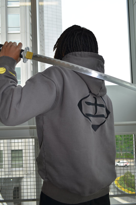 Back view of Kenpachi Zaraki hoodie showing Division 11 kanji with sword by Solace Studios