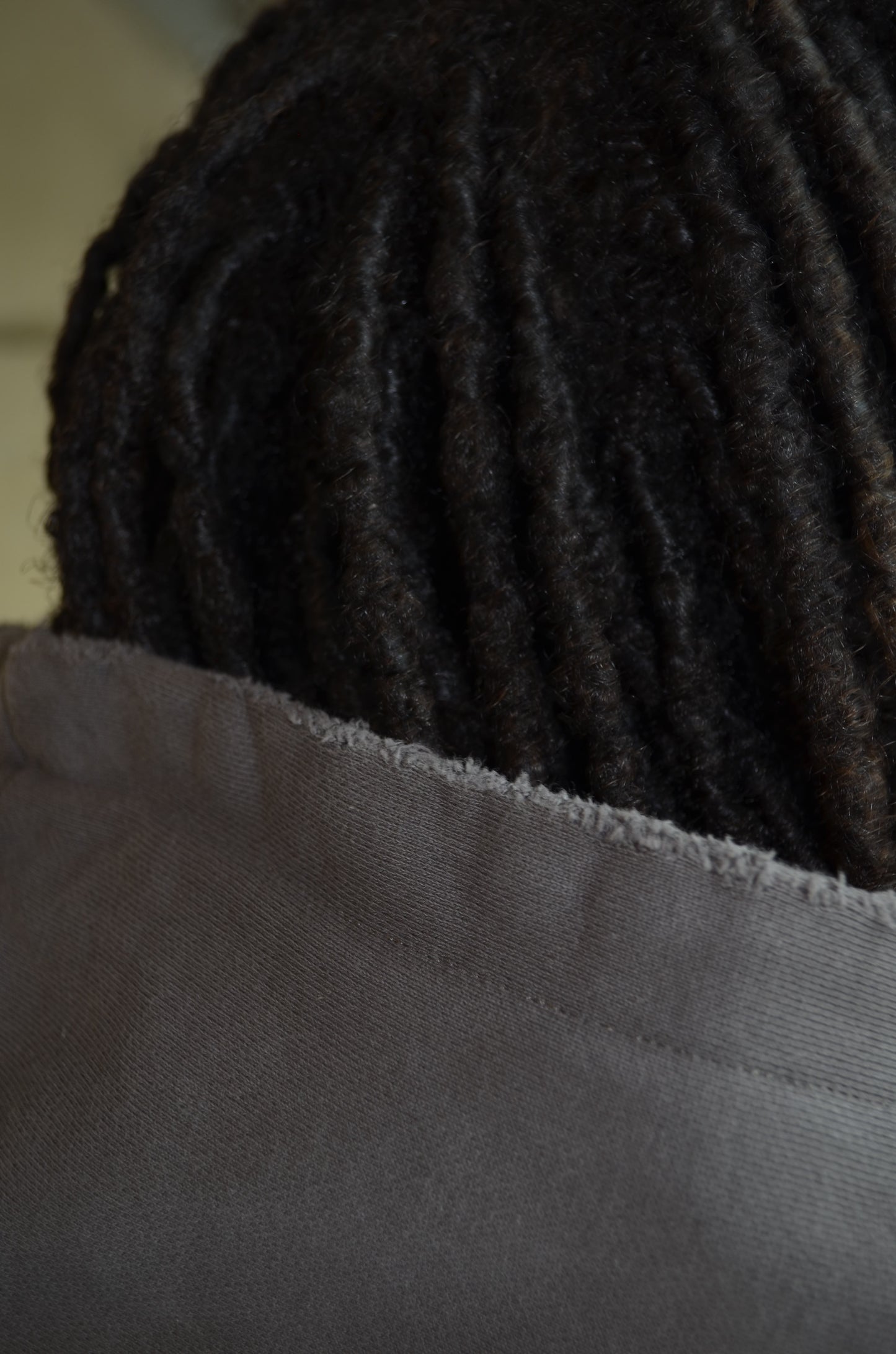 Closeup of frayed distressed cuff detail on Kenpachi Zaraki hoodie by Solace Studios