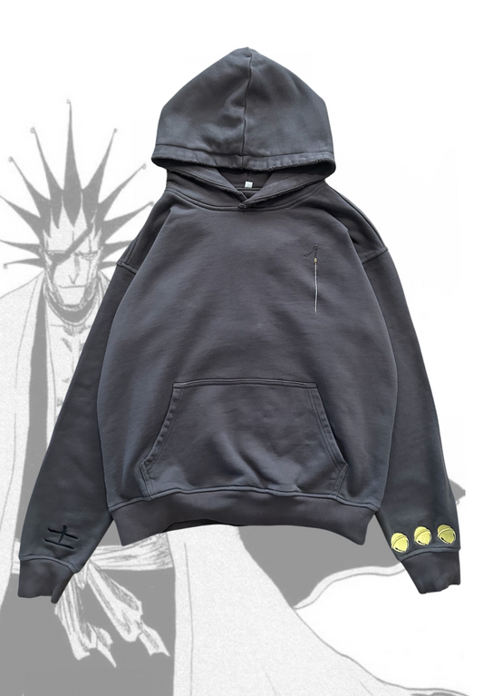 Front flat lay of Kenpachi Zaraki hoodie charcoal colorway with Kenpachi background by Solace Studios